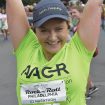 Sarah Happy cheerfully crosses the finish line at the 2017 AACR Rock ’n’ Roll Half Marathon.