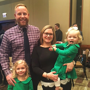 Michael and Rachel Hamer stand with their children, Rosemary, at left, and Estelle.