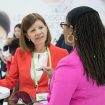 Dr. Elena Martinez of the University of California, San Diego in La Jolla, left, chats with Dr. Chanita Hughes-Halbert of the Medical University of South Carolina in Charleston during an event celebrating the 20th anniversary of Women in Cancer Research at the AACR Annual Meeting 2019 in Atlanta.