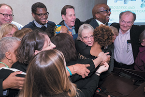 Patient advocates gather for an impromptu group hug with the Scientist↔Survivor Program (SSP) chair Dr. Anna D. Barker during the SSP closing session at the American Association for Cancer Research Annual Meeting 2017 in Washington, D.C. Photo by © AACR/Phil McCarten 2017​