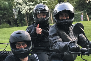 Michael Ross on his motorcycle with his son, Jacob, and wife, Wendy. The Rosses bought a motorcycle with a sidecar when Michael became too weak to ride his bicycle due to chemotherapy. Photo courtesy of Wendy Ross.