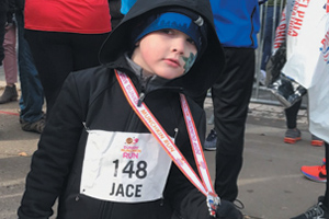 Jace Marchiano warms up after completing the Dunkin’ Munchkin Kids Fun Run in November 2019. Photo courtesy of Daneen Marchiano.
