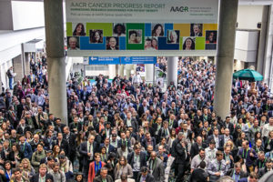 Participants make their way up stairs and escalators to a March 31 session at the AACR Annual Meeting 2019 in Atlanta. More than 21,000 people attended the meeting.