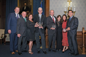 The “Reaching for the Stars” gala, sponsored by Party With a Purpose, was held in Philadelphia in October to benefit the AACR. From left are John Parker, Party with a Purpose co-chair; Mitch Stoller, AACR Foundation chief philanthropic officer and vice president of development; Esperanza and David Neu, AACR Humanitarian Award honorees; M. Sean Grady, MD, Penn Medicine, Philadelphia, Scientific Achievement Award honoree; Margaret Foti, PhD, MD (hc), AACR chief executive officer; event emcee Nydia Han of WPVI-TV in Philadelphia; and John Y.K. Lee, MD, MSCE, Early Career Investigator Award honoree.