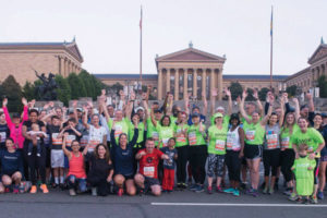 The AACR Runners for Research, staff, and volunteers cheer after the 2017 AACR Rock ’n’ Roll Philadelphia Half Marathon.