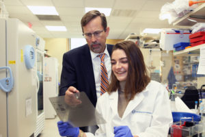 Photo: David A. Tuveson, MD, PhD, AACR president and Cancer Center director at the Cold Spring Harbor Laboratory in New York, consults with graduate student Nicole Sivetz. © Gina Motisi, 2020/CSHL
